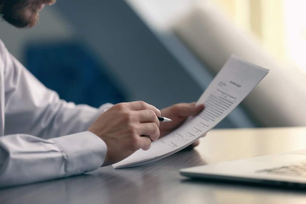 Cropped image of a businessman reviewing a contract